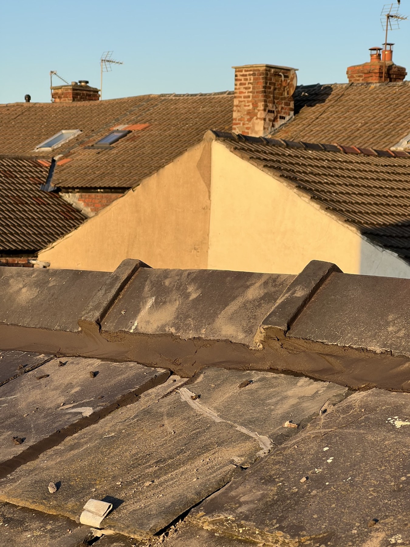 Ridge tiles repointed by Wavertree Roofing